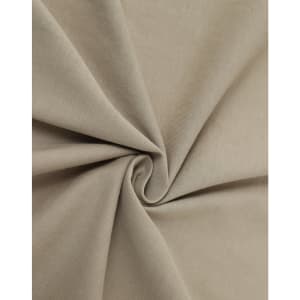 A close-up of beige premium cotton fabric, showcasing a smooth texture and soft, folded appearance.