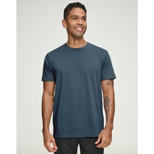 A navy blue men's premium cotton short sleeve t-shirt displayed on a smiling male model, featuring a logo.