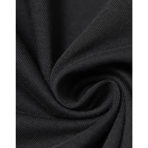 A close-up of black cotton fabric, showcasing its soft texture and fine weave. The fabric is arranged in a spiral.