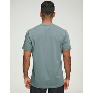 A men's premium cotton short-sleeve tee shirt in a muted green colour, featuring a simple design and a logo.
