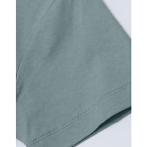 A close-up of a light blue short-sleeve cotton T-shirt with a smooth finish and a small logo.