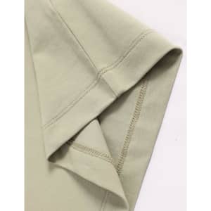 A close-up of a light green premium cotton short-sleeve tee shirt with a stitched hem and sleeve detail.