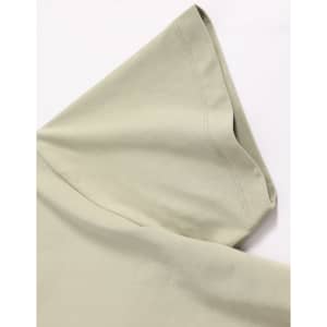 A light sage green short-sleeved cotton t-shirt with a rounded collar and visible stitching details. It has a logo.