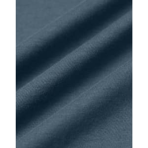 A close-up of soft, premium cotton fabric in a deep blue hue, showcasing its texture and quality.