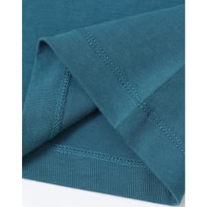 A teal ladies' premium cotton tee shirt, featuring a soft fabric and detailed stitching at the hems.