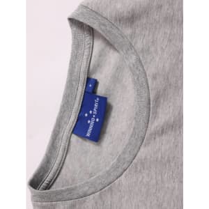 A close-up of a light grey ladies' premium cotton t-shirt featuring a rounded neckline and a branded label.