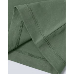 A green ladies' premium cotton short-sleeve tee shirt, featuring neat stitching at the sleeves. There is a logo present.