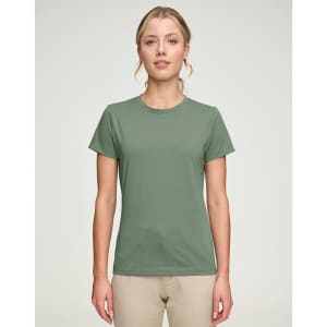 A green ladies' premium cotton short-sleeve tee shirt displayed on a model, featuring a simple design and a logo.