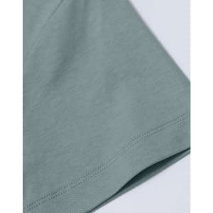 A close-up of a ladies' premium short-sleeve tee shirt in a soft green colour, featuring a smooth fabric texture.