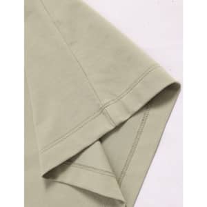 A close-up of a light green premium cotton T-shirt featuring short sleeves and neat stitching.