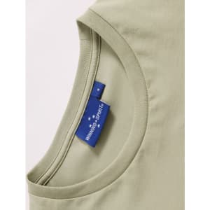 A light green ladies' premium cotton t-shirt showcasing a rounded neckline and a label with branding.