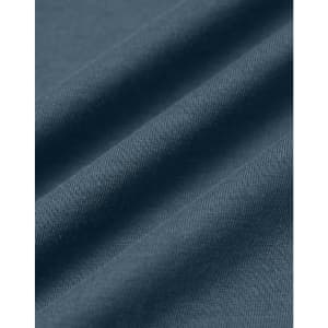 A close-up of a textured fabric in a soft, dark blue shade, showcasing the quality of cotton material.
