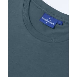 A women's short sleeve tee shirt in dark grey with a round neckline and a branded label.