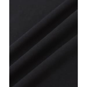A close-up of black cotton fabric with a smooth texture, featuring subtle folds.
