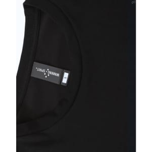 A black men's long-sleeve tee shirt with a rounded neckline and a tag showing sizing information.