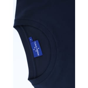 A navy blue premium cotton long sleeve tee shirt with a label inside the neckline.