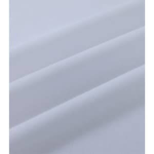 A close-up view of white cotton fabric, showcasing its smooth texture and soft folds.