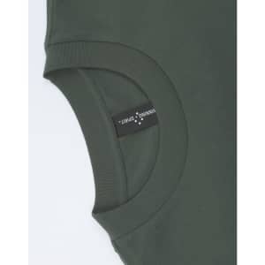 An olive green unisex oversized tee featuring a round neckline and a label on the side.