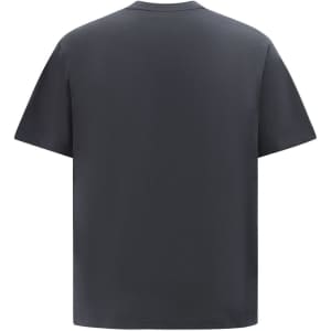 A heavy cotton oversized tee in dark grey, featuring a simple design and a relaxed fit. The garment has a logo.