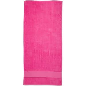 A pink terry velour beach towel, sized 75x150 cm, featuring a solid design and a subtle logo.