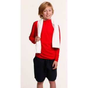 A young boy in a red long-sleeve top and black shorts holds a white terry velour fitness towel.