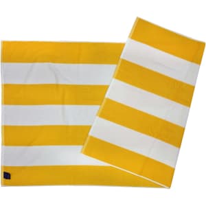 A striped beach towel featuring alternating yellow and white stripes, with a logo in one corner.