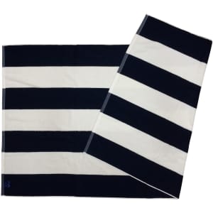 A striped beach towel featuring navy blue and white stripes, with a logo in one corner.
