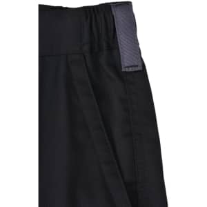 Close-up of black unisex utility stretch cargo work shorts featuring a wide waistband and a tag.