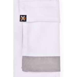 A set of unisex cargo work shorts in white, featuring a grey cuff and a logo on the pocket.
