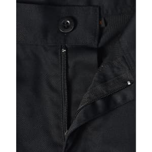 A close-up of black unisex utility stretch cargo work pants, featuring a button and zip closure.