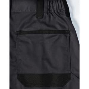 A close-up of black unisex utility stretch cargo work pants featuring a large back pocket and elastic waistband.