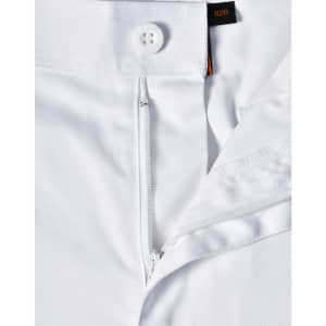 A close-up view of white unisex utility stretch cargo work pants showcasing the waistband and button detail.