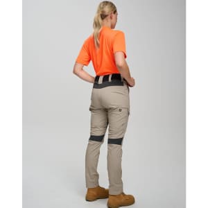 Work pants in light beige with grey accents, worn by a person in an orange shirt, facing away from the camera.