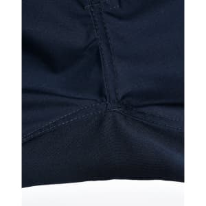 Close-up of navy rip-stop poly/cotton stretch work pants, highlighting the stitching detail and fabric texture.