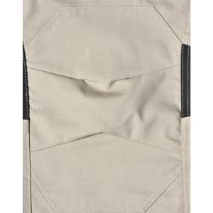 Light grey fabric of work pants featuring detailed stitching and black accents, with a logo present.