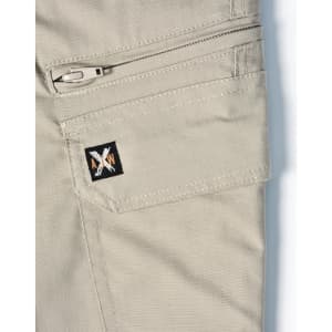 A close-up of light khaki work pants featuring a zippered pocket and a small logo on the side.