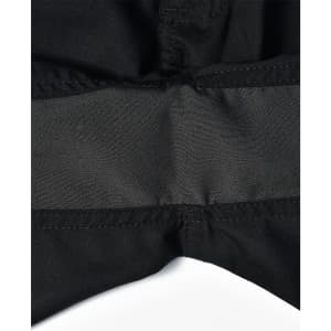 A close-up of black rip-stop poly/cotton stretch work shorts featuring a waistband detail. The shorts have a logo.