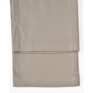 Unisex cotton stretch ripstop work pants in a light beige shade, showcasing a smooth, flat hem at the cuff.