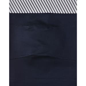 A pair of navy blue unisex cotton stretch ripstop segmented work pants with a patterned waistband and a logo.