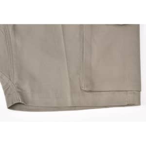 A pair of unisex cotton stretch ripstop work shorts in a light khaki colour, featuring a pocket and stitching details.