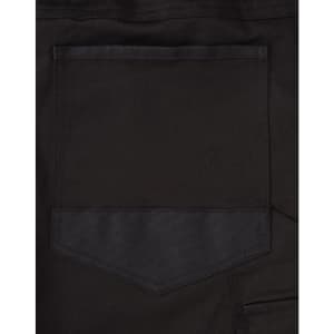 A close-up image of the back pocket of black unisex cotton stretch drill cuffed work pants.