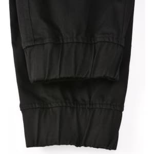 Cuffed work pants in black cotton stretch drill fabric, featuring a comfortable, fitted design.