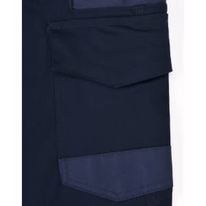 A close-up of navy blue unisex cotton stretch drill work pants featuring a side pocket and patch detail.