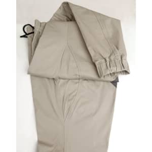 Unisex cotton stretch drill cuffed work pants in a light beige colour, featuring a cuffed design and a drawstring.