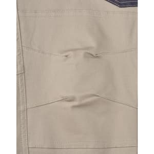 Cuffed work pants in beige with pockets and stitching details. The fabric has a stretch drill quality.