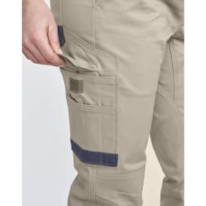Unisex cotton stretch drill cuffed work pants in khaki with a side pocket and navy detailing.