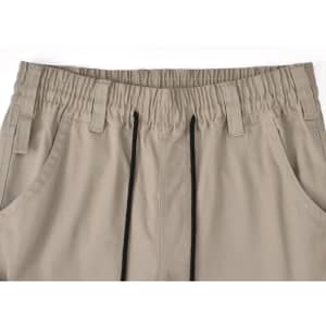 Pair of unisex cotton stretch drill work pants in a beige colour with an elasticised waistband and drawstring detail.