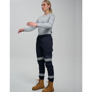 Cotton stretch drill cuffed work pants in navy blue with reflective tape, featuring pockets and a casual top.