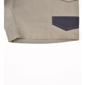 Unisex cotton stretch drill work shorts in khaki with a navy accent pocket. Features a logo on the side.