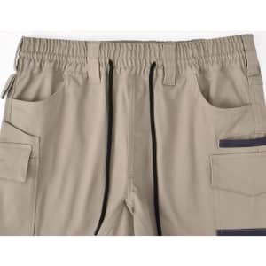 Unisex cotton stretch drill short work shorts in beige with an elastic waistband and multiple pockets.